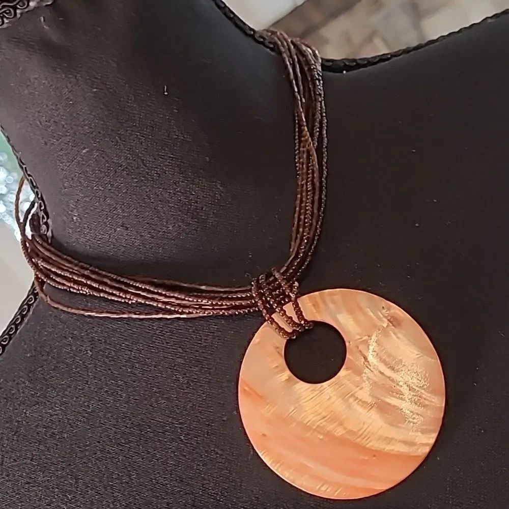 Abalone disc with stranded glass beads